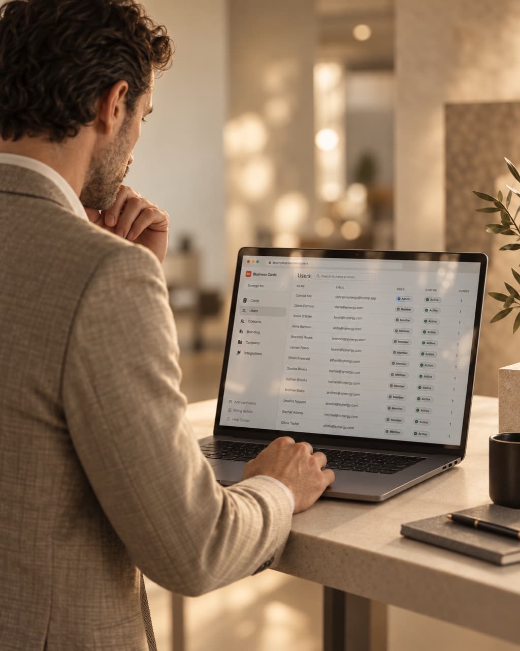 An IT administrator reviewing employee cards in the HeyDrop dashboard