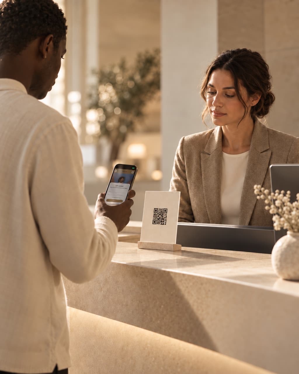 A patient scanning a QR stand at a clinic reception