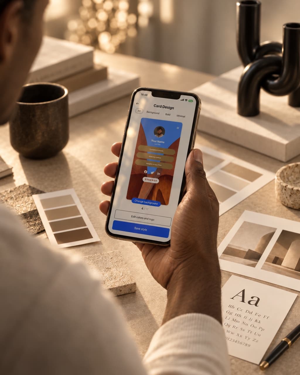 HeyDrop card design templates on a phone above brand swatches