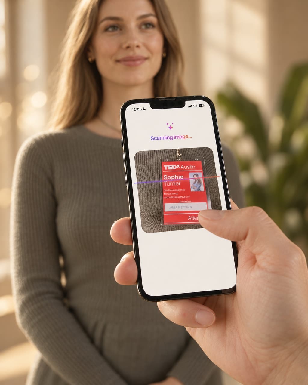 The HeyDrop AI Scanner reading a TEDx badge