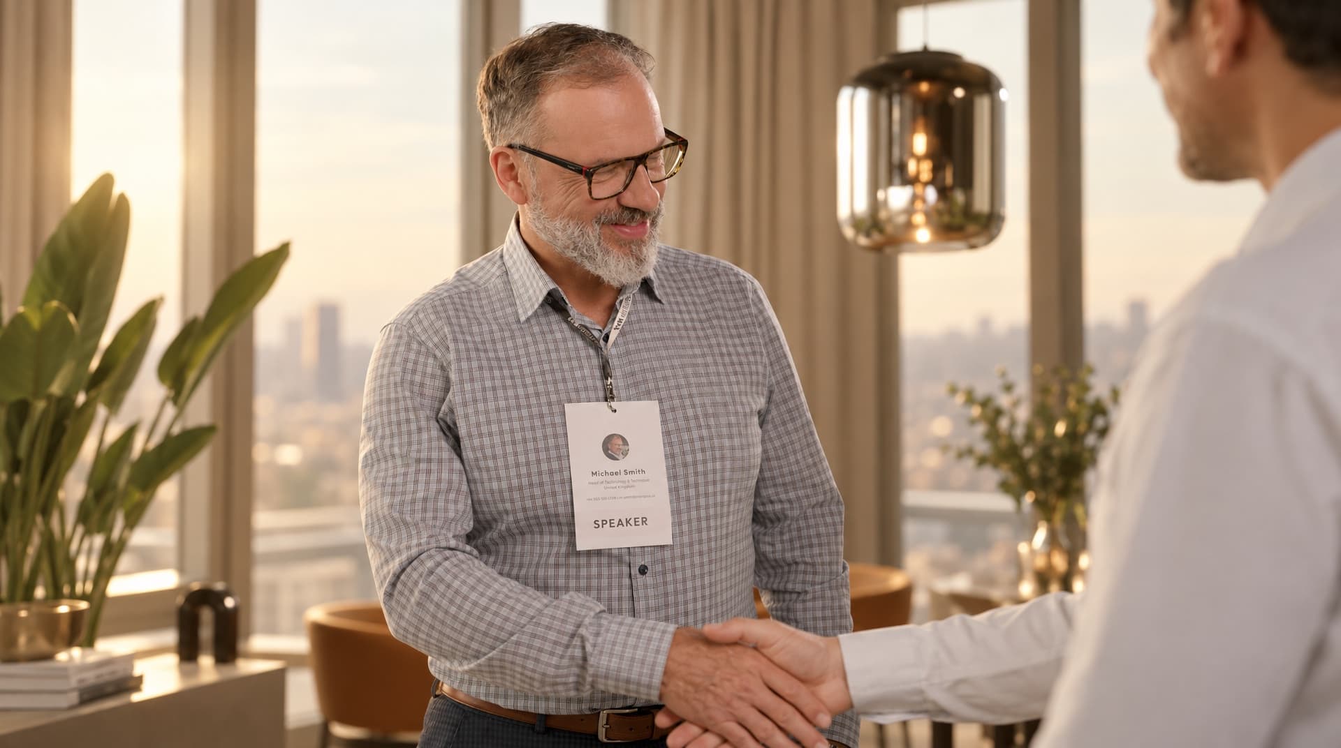 A speaker with a conference badge at a networking event